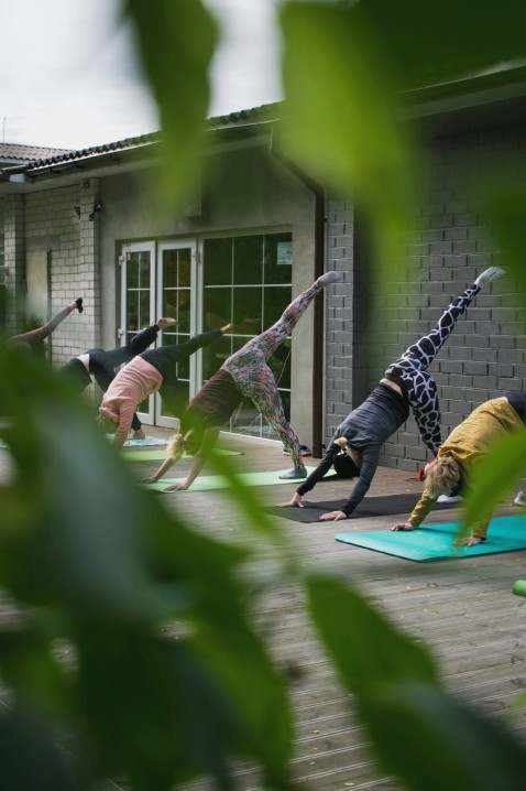 Instructor guiding prenatal pose